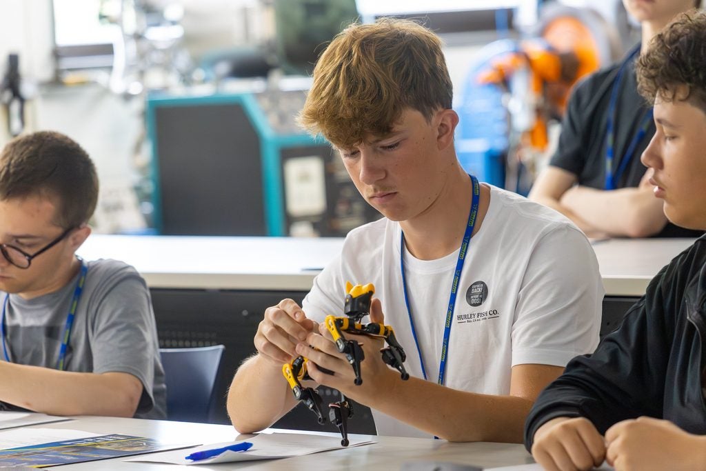 Students explore robotics and automation technologies hands on in a class open to high school students at Alfred State College